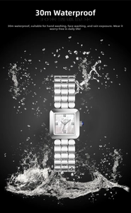 Close-up of square steel watch showing 30m waterproof performance with water splashes