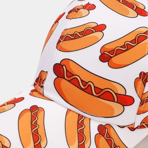 Detail of all-over hot dog print on white cotton fabric baseball cap with quality stitching