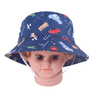 Close-up of kids bucket hat with car and airplane patterns and adjustable chin strap