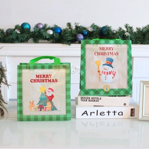 Christmas themed non-woven gift bags with cartoon Santa and snowman prints