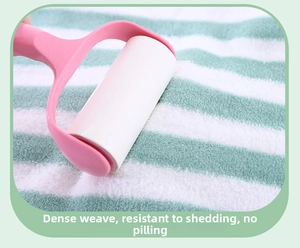 Detail of high-density striped coral fleece towel showing no shedding with a lint roller