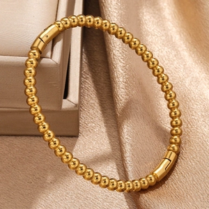 Elegante goudkleurige titanium stalen kralenarmband met gepolijste vintage bamboe look