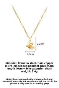 Detail of gold butterfly pendant with cat-eye stone and crystal pave on titanium chain