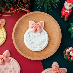 Christmas bow and bell fondant cookie mold with Santa and reindeer relief patterns