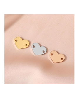 Set of three blank heart-shaped stainless steel charms in gold, silver, and rose gold.