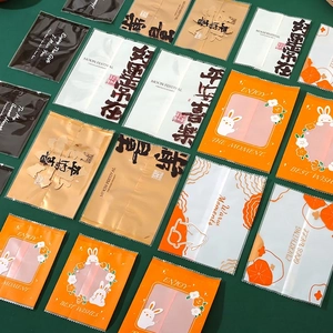 Assorted festive Mid-Autumn mooncake packaging bags with rabbit motifs and calligraphy