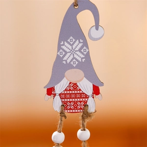 Close-up of red and grey wooden Christmas gnome ornament with hemp rope and white bead