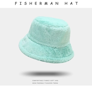 Close-up of soft plush fabric texture on a light blue fisherman bucket hat