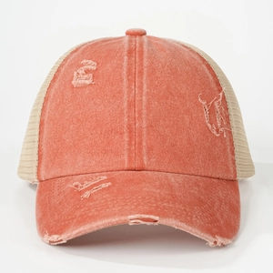 Close-up of coral distressed cotton baseball cap with mesh back and vintage torn brim