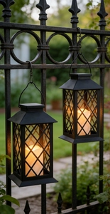 Detail of vintage garden lantern with diamond grid hanging on a black iron fence
