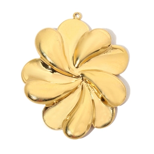Detailed close-up of a vintage golden flower pendant with polished eight-petal design
