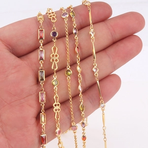 Detail of colorful gemstone gold-plated necklaces featuring zircon in multiple shapes