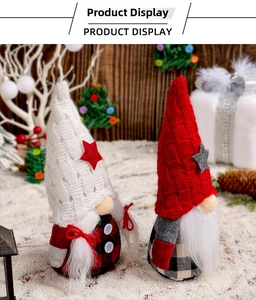Close-up of plush Christmas gnomes with knit star hats and festive plaid holiday outfits