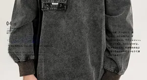 Detail of washed grey cotton top showing heavy texture and ribbed cuff design