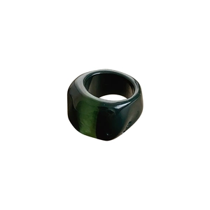 Minimalist deep green chunky resin ring with a vintage gradient aesthetic on white background