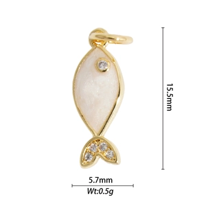 Detailed view of tiny gold fish pendant with white enamel and size 15.5mm by 5.7mm