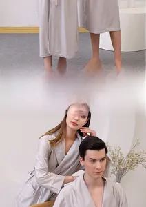 Detail of light gray waffle robe with textured fabric, V-neck and waist tie for couples