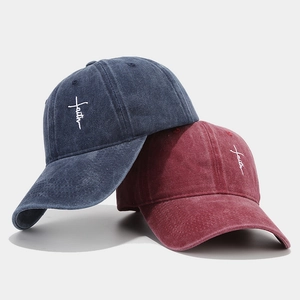 Classic washed cotton baseball caps in navy and burgundy with faith embroidery