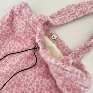 Detail of pink leopard faux fur bag showing magnetic silver clasp and black drawstring