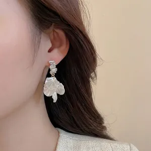 Elegant long drop earrings with cubic zirconia and white resin flower petals for women