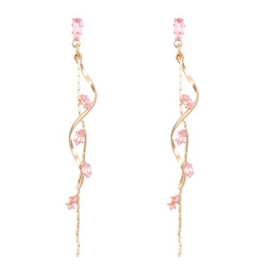 Detail of gold spiral tassel earrings with pink marquise-cut cubic zirconia crystals