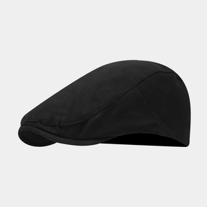 Detailed side view of black cotton canvas flat cap featuring fine twill texture and stitching