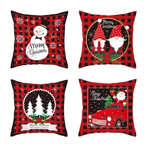 Set of four red and black buffalo plaid Christmas pillow covers with holiday patterns