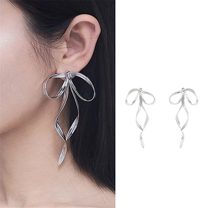 Silver bow ribbon long dangle earrings in S925 silver with a sleek metallic finish