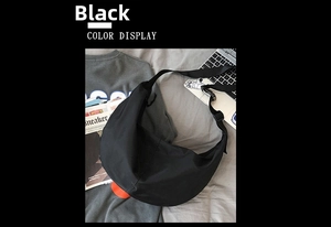 Flat lay of a large black nylon crescent crossbody bag with an adjustable wide strap