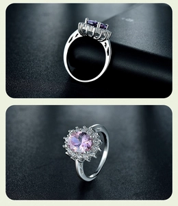 Detail of 925 silver halo ring with oval pink gemstone and vintage hollowed-out patterns