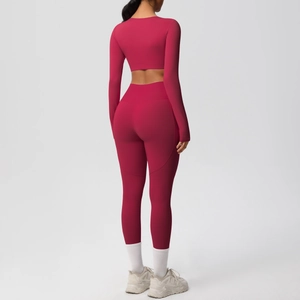 Detail of high-waist yoga pants and cropped long sleeve top from back view