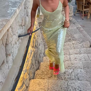 Sparkling mint green sequin slip dress with backless design and slim fit for evening party