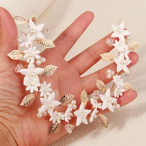 Handmade bridal headband with white clay flowers, gold metal leaves and pearls