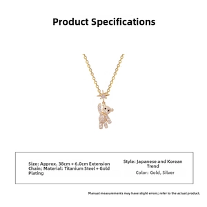 Detailed view of sparkling crystal bear pendant on a gold plated stainless steel chain