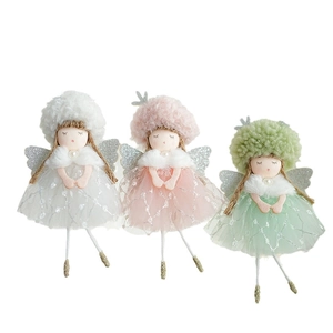 Three plush Christmas angel dolls with tulle skirts and silver wings in white, pink, and green