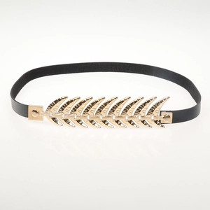 Detail view of a slim black PU leather belt featuring a golden leaf buckle on white background