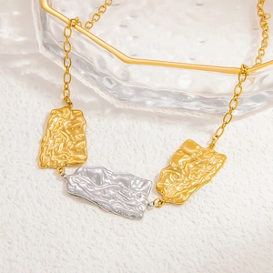 Minimalist stainless steel necklace featuring gold and silver wrinkled rectangle charms