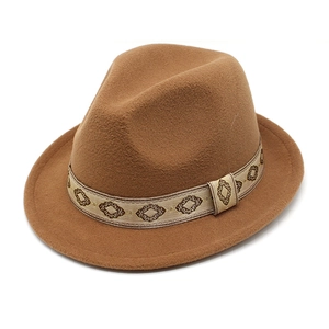 Close-up of caramel wool fedora hat featuring a vintage geometric pattern jacquard band
