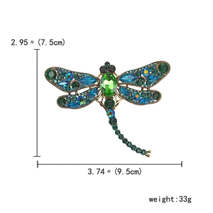 Detailed size view of the vintage gold dragonfly brooch with colorful crystals