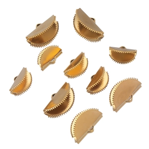 Detailed view of ten golden semi-circular serrated crimp ends for jewelry making