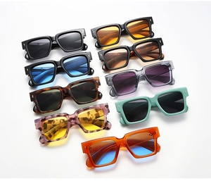 Macro display of diverse colorful square sunglasses frames with metallic rivet details