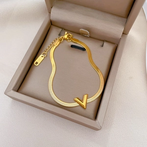 Minimalist gold titanium steel chain bracelet featuring a V-shaped pendant and adjustable clasp