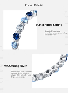 Macro detail of S925 sterling silver stamp and blue gradient zirconia stones on ring