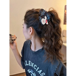 Cute plaid bow hair claw clip with rabbit embroidery shown on a stylish ponytail