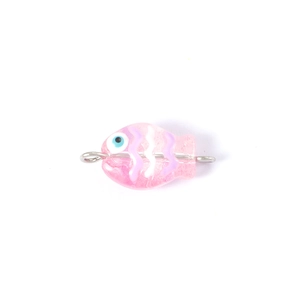 Detailed view of pink handmade glass fish bead with white wave patterns for DIY jewelry