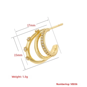 Detailed view of triple-layered C-shape gold earrings with dimensions 17mm by 15mm