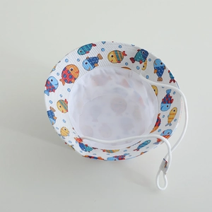 Kids' white sun bucket hat with colorful cartoon fish print and adjustable chin strap
