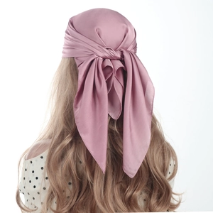 Detailed back view of dusty rose satin square scarf showing smooth silky drape and texture