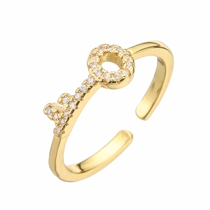 Gold plated open ring featuring a key motif accented with sparkling cubic zirconia stones