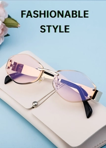 Fashion rimless sunglasses with gradient lenses resting on an off-white glasses case